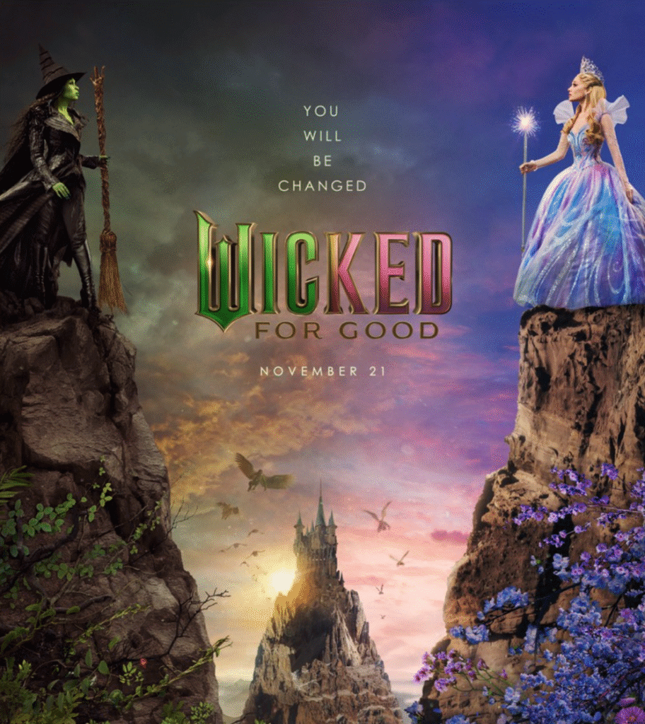A green-skinned witch with a broom and a fairy-like figure holding a glowing wand stand on separate cliffs. A castle and sunset sky are in the background. “Wicked: For Good” and a release date appear between them.